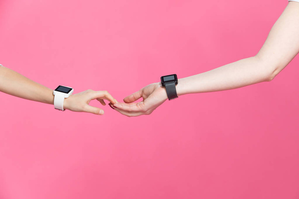 Mother and daughter with smartwatches  - Photo, Image