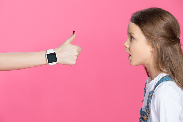 Girl and woman with smartwatch  - Фото, зображення