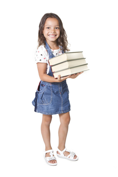 Yung girl holding stack of books - 写真・画像