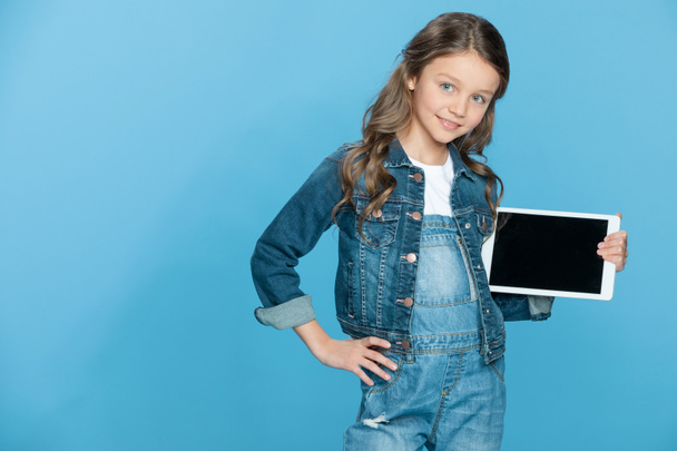 Girl holding digital tablet  - Фото, зображення