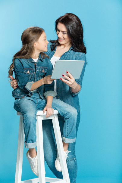 mother and daughter with digital tablet  - 写真・画像