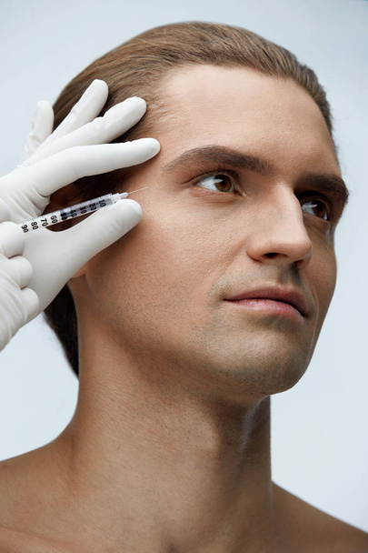 Cosmetology. Handsome Man Getting Filler Injections In Face Skin - Valokuva, kuva