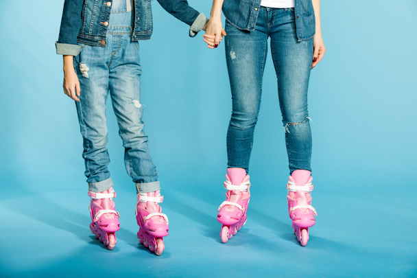 mother and daughter in roller skates - Photo, Image