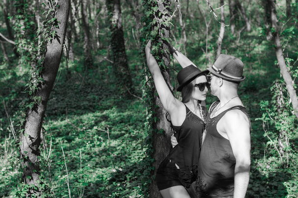sexy boy and a girl leaning on  tree - Foto, Imagem