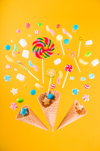 Waffle cones and candies  - Фото, изображение