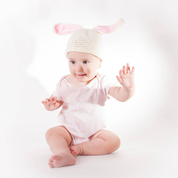Baby girl in a rabbit hat - Фото, зображення