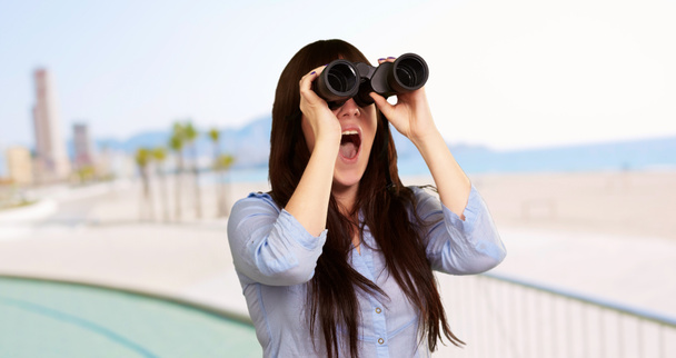 Portrait Of A Young Woman Looking Through Binoculars - Photo, Image