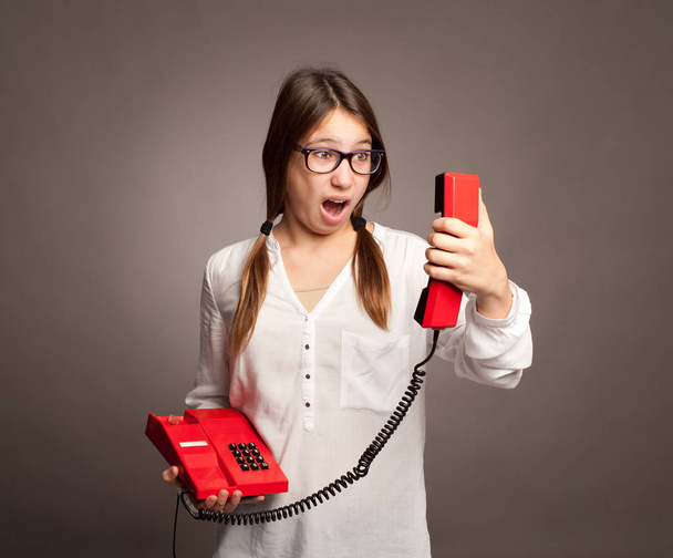 young girl holding a telephone - Foto, imagen