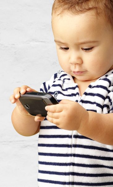 Portrait Of Baby Boy Using Cell Phone - Foto, Bild
