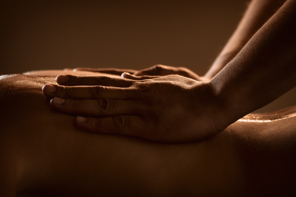 Massage closeup with hands of professional masseur - Foto, Imagen