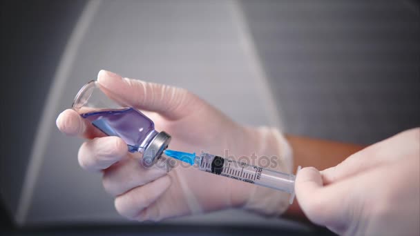 Filling medicine from ampoule into syringe - Footage, Video