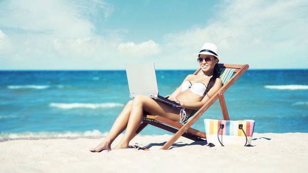 beautiful woman relaxing on summer beach - Фото, изображение