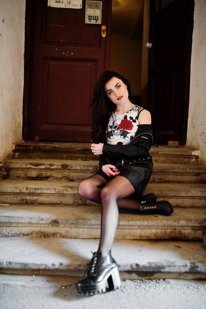Young goth girl on black leather skirt and jacket posed on stair - Φωτογραφία, εικόνα