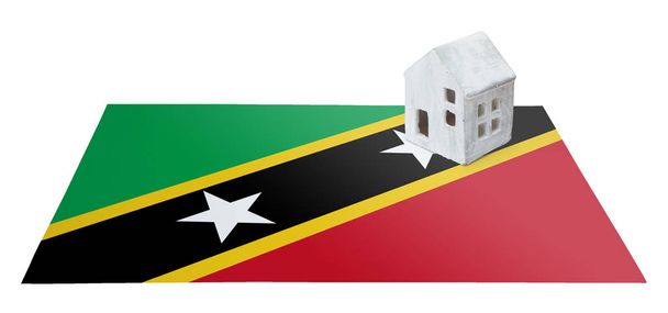 Huisje op een vlag - Saint Kitts en Nevis - Foto, afbeelding