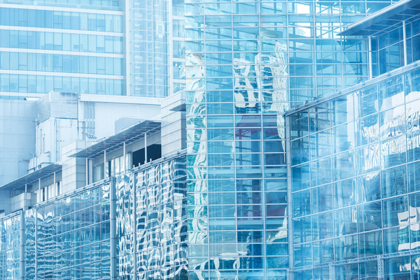 Cloud reflection in high glass offices.Blue reflection of the sk - Photo, Image