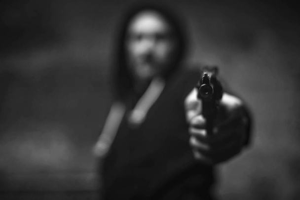 Loaded wicked criminal pulling a gun on somebody - Foto, Imagen