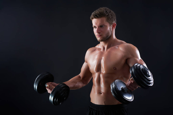 Young fitness man in studio - Foto, imagen