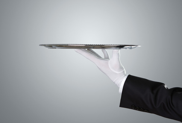 Waiter holding empty silver tray - Photo, Image
