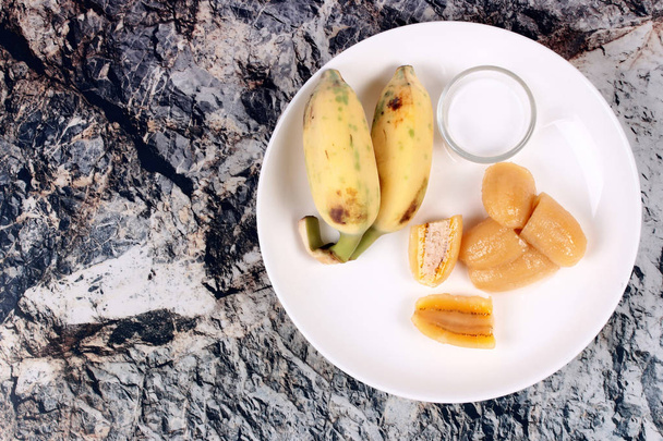 Boiled banana in syrup and wholes of banana. - 写真・画像