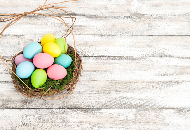 Easter eggs decoration nest Vibrant colors - 写真・画像
