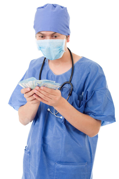 Heureux médecin masculin tenant des billets de banque, isolé
 - Photo, image