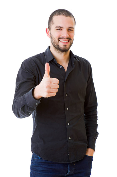 Young casual man going thumbs up, isolated on white background - Fotoğraf, Görsel