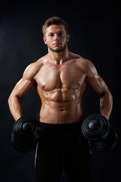 Young fitness man in studio - Valokuva, kuva