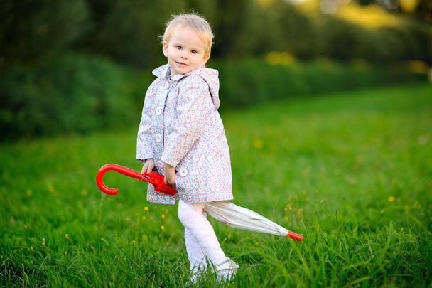 Portrait of a little girl with umbrella - 写真・画像