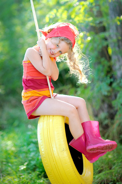 Portrait of little girl outdoors in summer - Fotó, kép