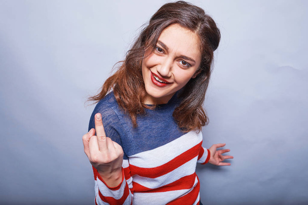 cool American girl showing middle finger - Foto, immagini