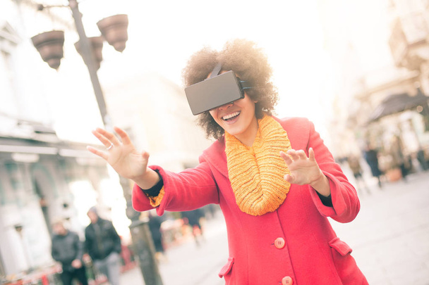 Beautiful woman using high tech virtual reality glasses outdoor - Fotoğraf, Görsel