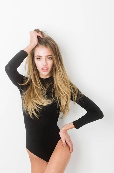 Pretty sexy girl with long hair in sexi black bodysuit - Foto, Imagen