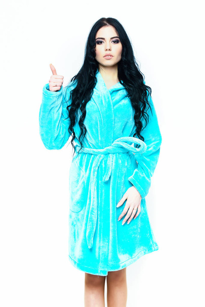 sexy girl posing in turquoise velour bathrobe - Фото, изображение
