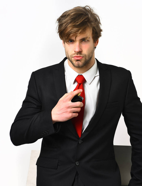 Caucasian stylish business man posing with perfume - Zdjęcie, obraz
