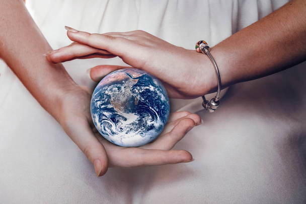 Beautiful planet Earth in female hands - Zdjęcie, obraz