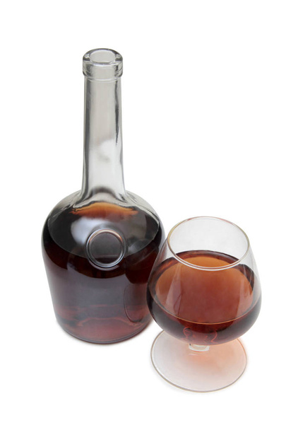 Cognac bottle on white one - Фото, зображення
