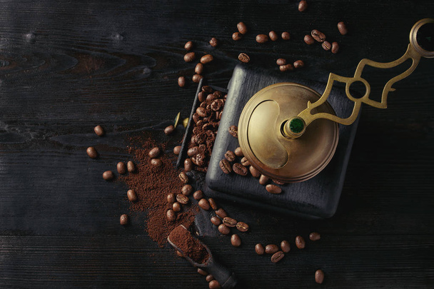Roasted coffee beans over black - Photo, image