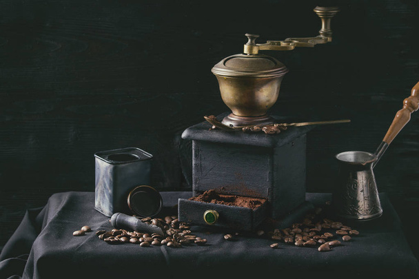 Roasted coffee beans over black - Fotoğraf, Görsel