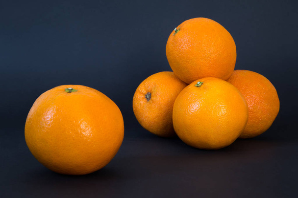 Fresh oranges isolated on black background - Φωτογραφία, εικόνα