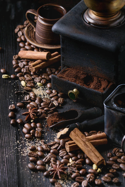 Black coffee beans with spices - Foto, imagen