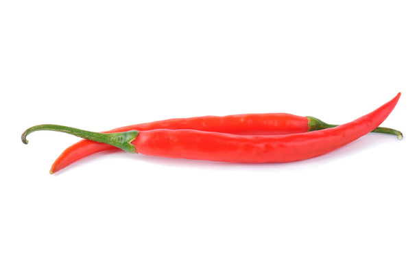 Two red chili peppers on a white - Photo, Image