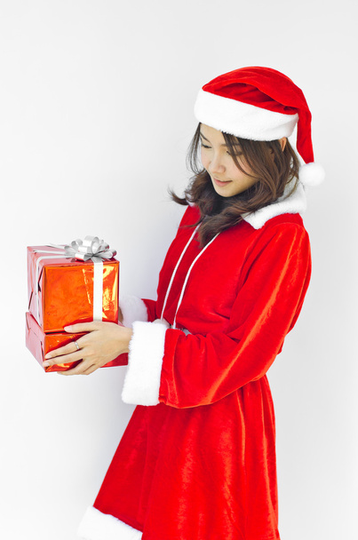 santa claus hat with grey christmas gift box - Фото, изображение