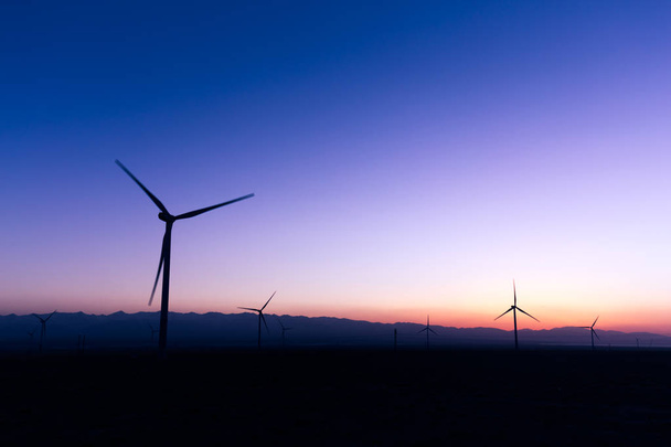 wind turbines in field at twilight - Fotoğraf, Görsel