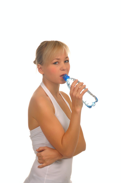 beautiful woman with bottle of water over white - Фото, зображення