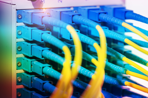 fiber optic telecommunication cables on blur background - Photo, Image
