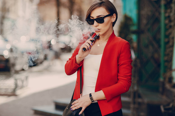 girl with the electronic cigarette - 写真・画像