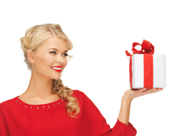 Lovely woman in red dress with present - Foto, Imagen