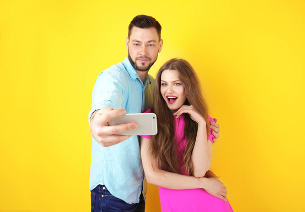 Happy young couple taking selfie  - Photo, image