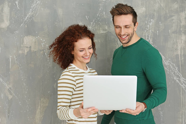 Happy young couple with laptop  - Photo, image
