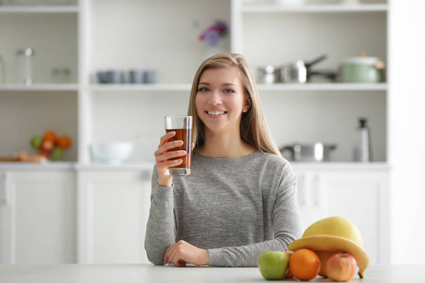 Young woman with glass of fresh juice - Photo, image